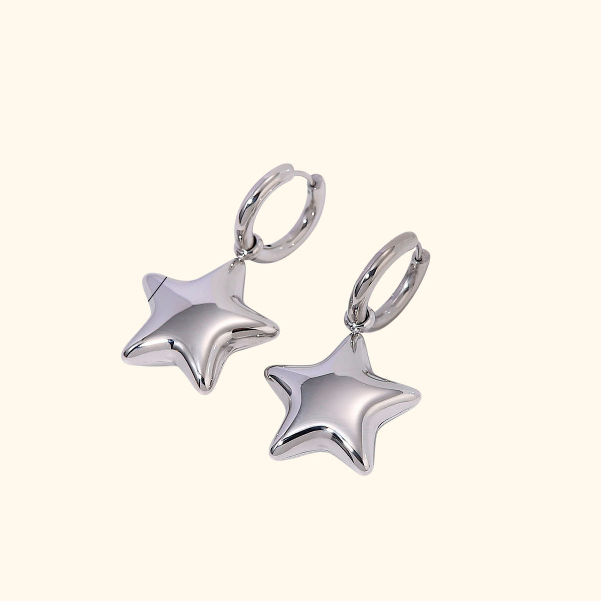 Arracadas estrella plateada